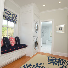coastal haven design | coastalhavendesign.com | laundry room with navy and coral window seat
