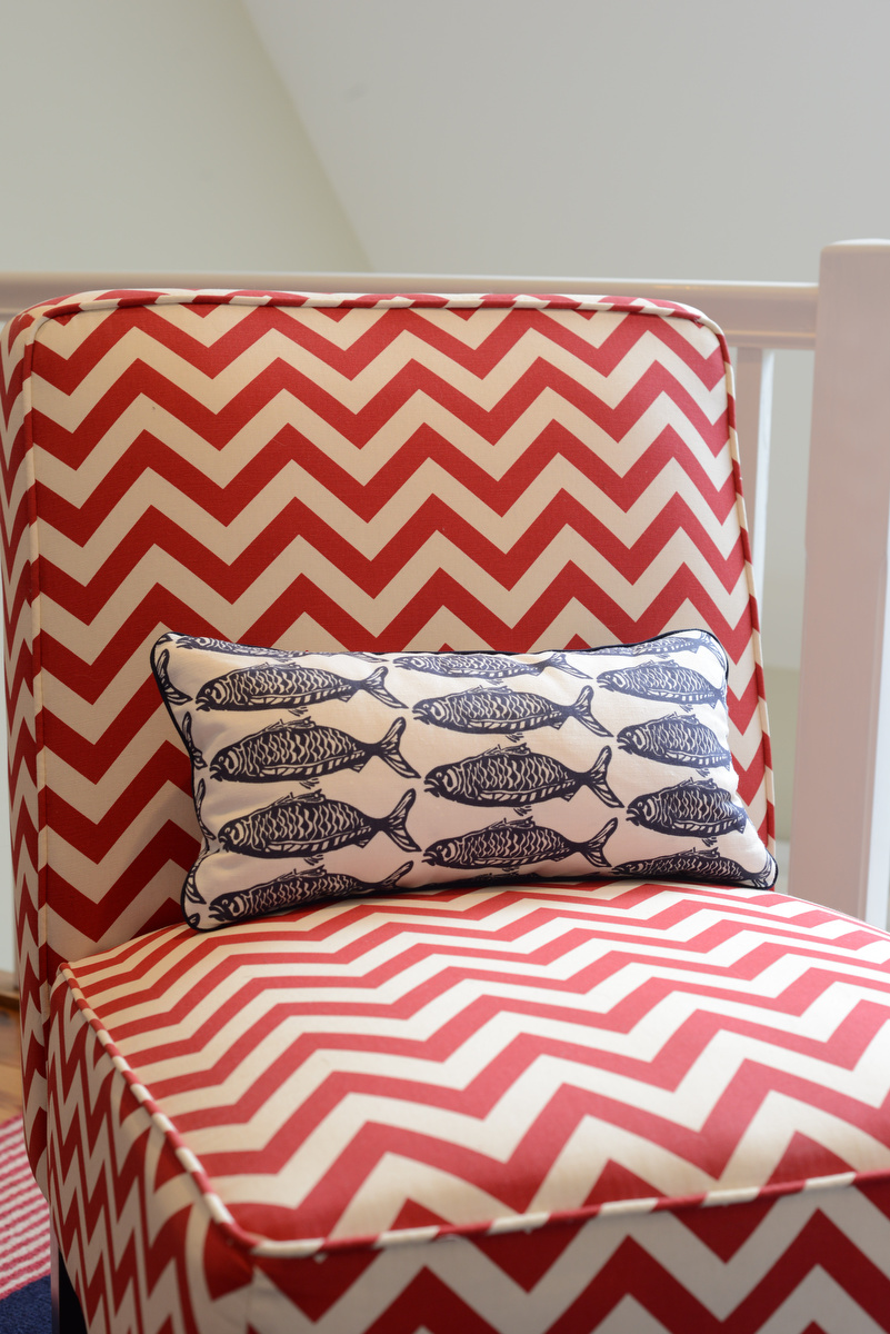 coastal haven design | coastalhavendesign.com | red chevron chair and navy fish pillow